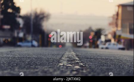 A selective shot from the level of the dividing line on a blurred background of the city Stock Photo