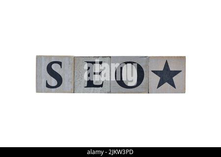 Wooden cubes showing the letters SEO (Search Engine Optimization) on white background, for designs and layouts Stock Photo