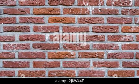 Background of strong red bricks. Texture of brick layers Stock Photo