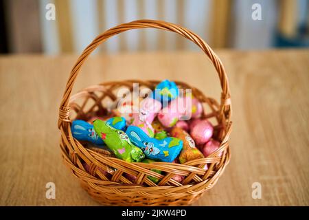 The Favorina brand small Easter chocolate bunnies packed in foil in a basket Stock Photo
