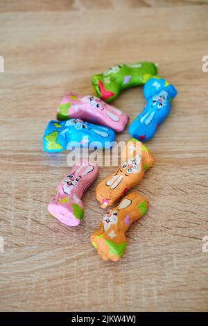 The Favorina brand chocolate Easter bunnies on a wooden table Stock Photo