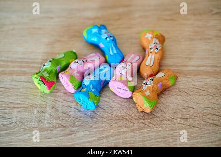 The Favorina brand chocolate Easter bunnies on a wooden table Stock Photo