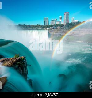 A scenic view of the Niagara Falls with architecture in the background Stock Photo