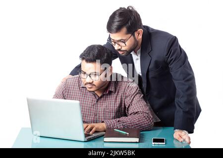 teacher helping student with learning computer education in isolated background Stock Photo