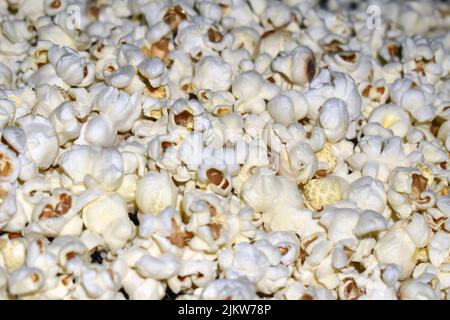 Popcorn in a plastic bag as a background. Close-up Stock Photo