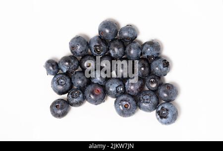 Blueberries on a macro scale. Dark berries in close-up. Ripe blueberries isolated. Healthy, natural fruit. Stock Photo
