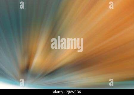 A starburst with blurry sparkles in orange and blue Stock Photo