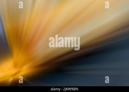 Bright starburst with sparkles in yellow and blue with motion blur Stock Photo