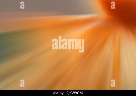 An orange starburst with dynamic sparkles with motion blur Stock Photo