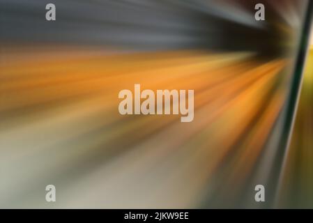 A blurry explosion of sparkles in gray and orange tones Stock Photo