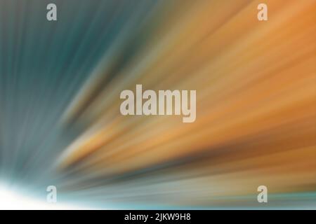 A starburst with light rays in orange and blue Stock Photo