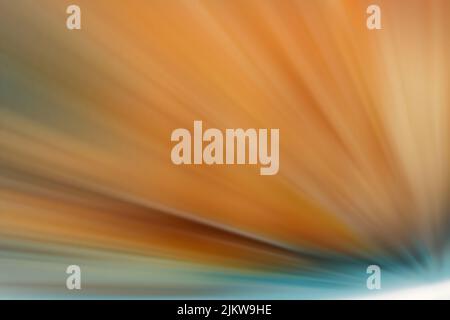 A bright orange starburst with dynamic sparkles Stock Photo