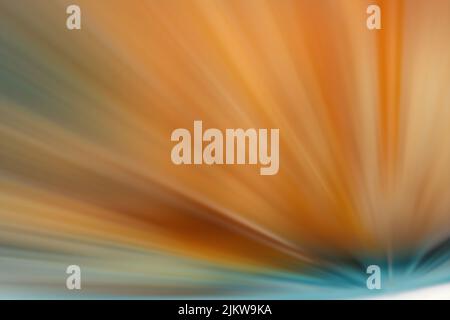 A dynamic texture of orange starburst with sparkles Stock Photo