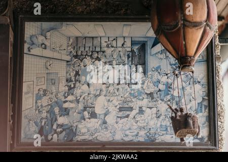 A closeup of a picture in a frame on a stone wall Stock Photo