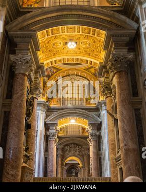A vertical shot of the beautiful interior of The Papal Basilica of Saint Peter in the Vatican Stock Photo