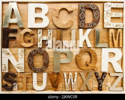 A top view of English alphabet with wooden letters Stock Photo