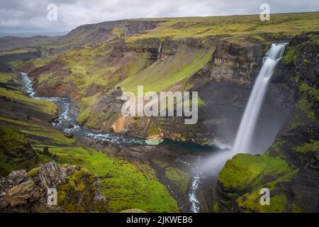 The waterfall Haifoss is situated near the volcano Hekla in the south of the Iceland. Stock Photo