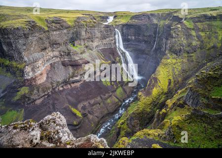 The waterfall Haifoss is situated near the volcano Hekla in the south of the Iceland. Stock Photo