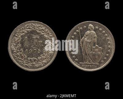 A closeup of vintage Swiss franc coins isolated on a black background Stock Photo