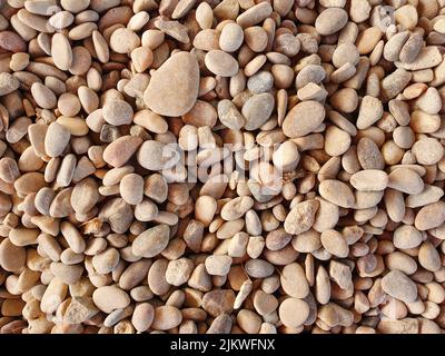 A background of small pebbles in different shapes and sizes Stock Photo