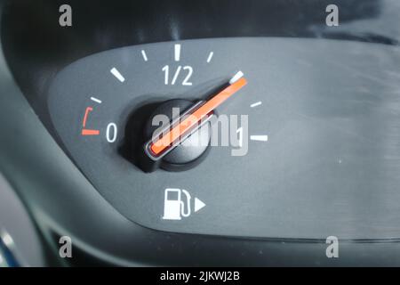 Close-up of a fuel gauge showing a three-quarters full fuel tank in a car. Stock Photo