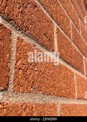 Close-up of new red brick wall in sunshine Stock Photo