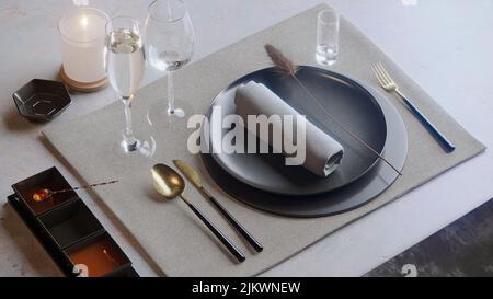 A closeup shot of plates and glasses on a restaurant table Stock Photo