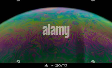 A part of colorful soap bubble isolated on black background Stock Photo