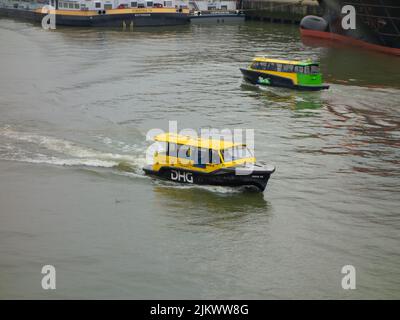 Water Taxi underway in waters of Rotterdam. Two taxis passing each other in Merwehaven. Stock Photo