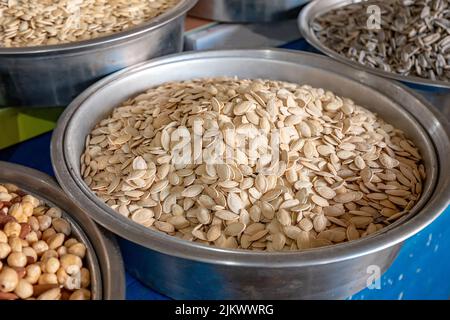 Melon and pumpkin seeds for sale at farmers market Stock Photo