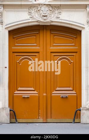 Paris, an ancient wooden door, beautiful facade in the Opera district Stock Photo