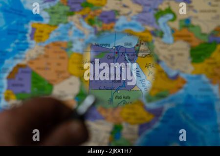 colorful view of egypt magnified with a magnifying glass, blurred background Stock Photo