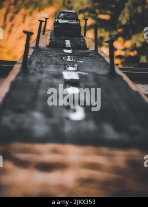 A view of drawn black car driving on road Stock Photo