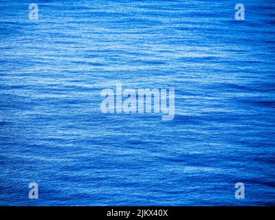waves of the blue caribbean sea from a cruise near Bahamas Stock Photo