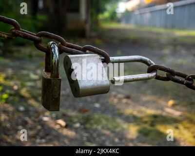 Rusty chain with an open padlock, Rusty chain with padlock Stock Photo