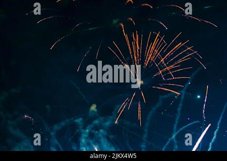 Inexpensive, budget, beautiful fireworks in the city, against the backdrop of the night sky. High quality photo Stock Photo