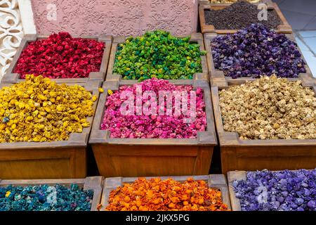 Many different colourful spices in squared wooden boxes in a spices market Stock Photo