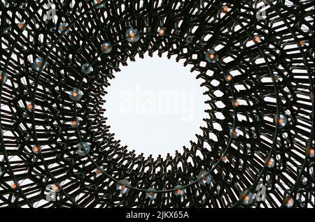 Low angle view of dark metal chain link wire fence pattern stretched ...