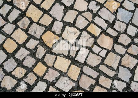 Top down view of famous Portuguese pavement, beautiful white cobblestones Stock Photo