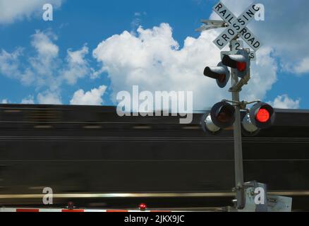 Taken through a windshield of a car a train passing through a crossing in rural Tennessee. Stock Photo