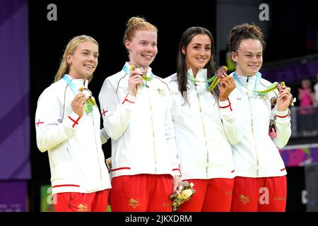 England's Anna Hopkin, Laura Stephens, Molly Renshaw, Lauren Cox celebrate with the bronze medals in the Women's 4 x 100m Medley Relay Final at the Sandwell Aquatics Centre on day six of the 2022 Commonwealth Games in Birmingham. Picture date: Wednesday August 3, 2022. Stock Photo