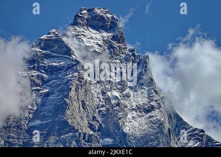Matterhorn peak covered viewed from Italian side on a sunny day in summer. Breuil-Cervinia, Italy. Stock Photo