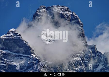 Matterhorn peak covered viewed from Italian side on a sunny day in summer. Breuil-Cervinia, Italy. Stock Photo