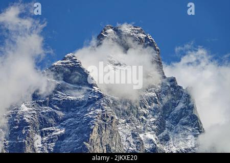 Matterhorn peak covered viewed from Italian side on a sunny day in summer. Breuil-Cervinia, Italy. Stock Photo