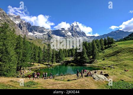 Summer alpine landscape with the Matterhorn (Cervino) reflected on the Blue Lake (Lago Blu) near Breuil-Cervinia. Aosta Valley, Italy - August 2022 Stock Photo
