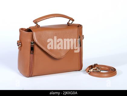 A beautiful shot of a brown leather bag on a white background Stock Photo