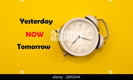 A quote for reminding people how important time is. A self motivation quote regarding time. Selective focus on the clock. Stock Photo