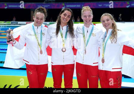 England's Lauren Cox, Molly Renshaw, Laura Stephens and Anna Hopkin celebrate with their bronze medals in the Women's 4 x 100m Medley Relay Final at the Sandwell Aquatics Centre on day six of the 2022 Commonwealth Games in Birmingham. Picture date: Wednesday August 3, 2022. Stock Photo