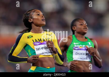 Elaine Thompson-Herah crossing the finish line first, her arms raised in victory, symbolizing her triumph over doubt and adversity.