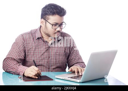 young designer drawing with digital graphic tablet and stylus pen Stock Photo